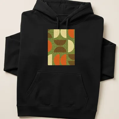 Textured abstract geometric shapes in green, orange, brown, cream, and yellow. — printed on a unisex hoodie