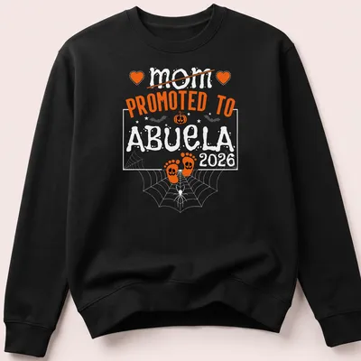 Halloween-themed t-shirt with text celebrating a mom becoming an abuela and baby feet — printed on a unisex sweatshirt