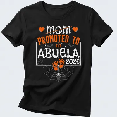 Halloween-themed t-shirt with text celebrating a mom becoming an abuela and baby feet — printed on a women's shirt