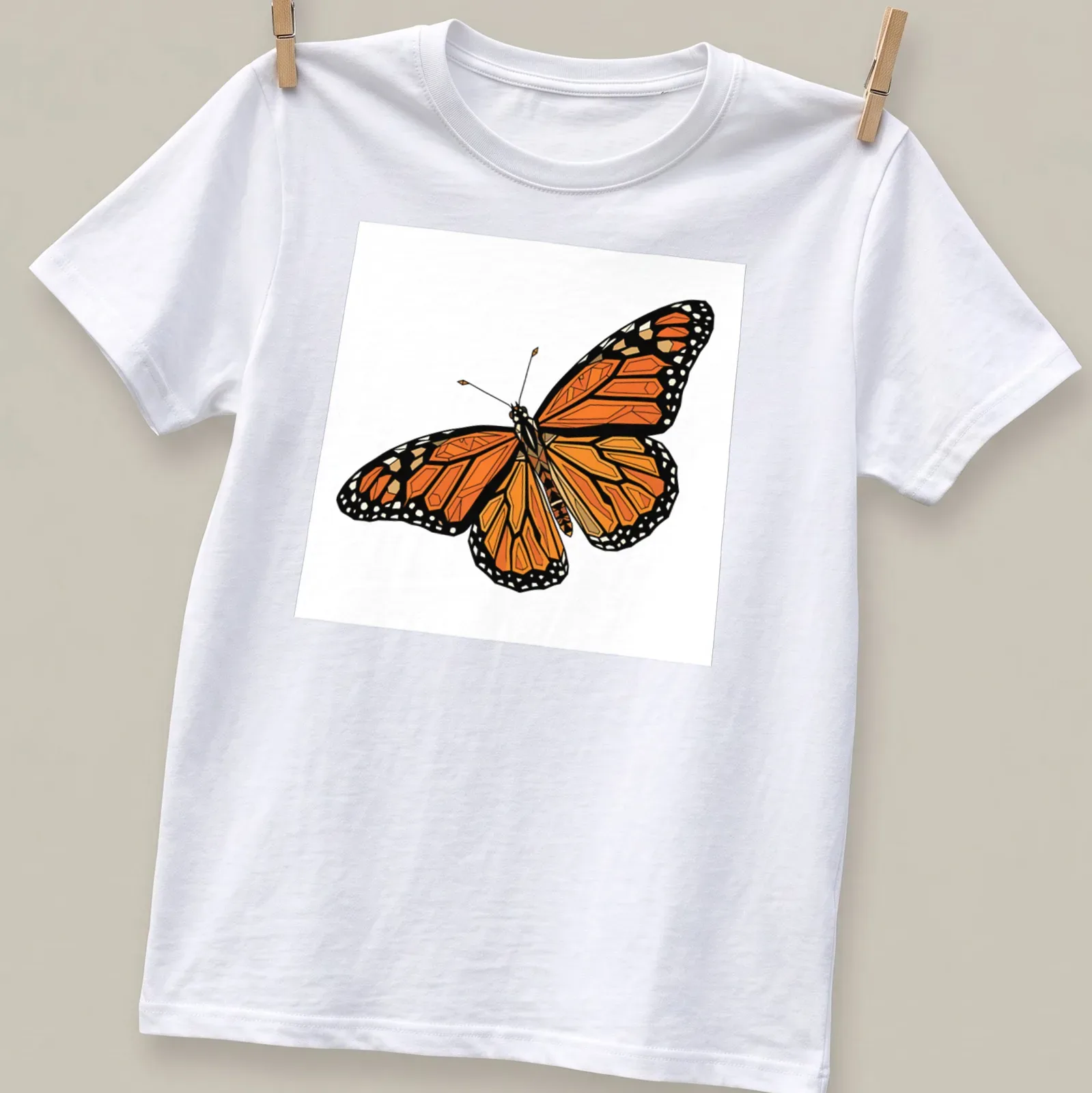 Geometric orange and black Monarch butterfly illustration on a — printed on a unisex t-shirt