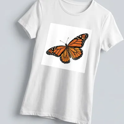 Geometric orange and black Monarch butterfly illustration on a — printed on a women's shirt