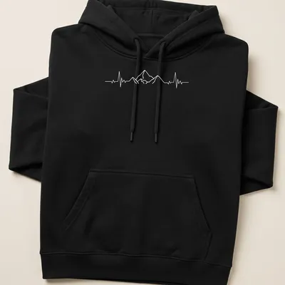 Minimalist design of mountains with a heartbeat line in white — printed on a unisex hoodie
