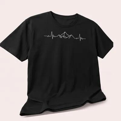Minimalist design of mountains with a heartbeat line in white — printed on a unisex t-shirt (angled view)