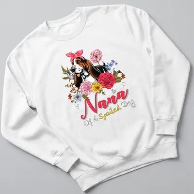 Basset Hound surrounded by vibrant flowers with text above in pink and yellow. — printed on a unisex sweatshirt
