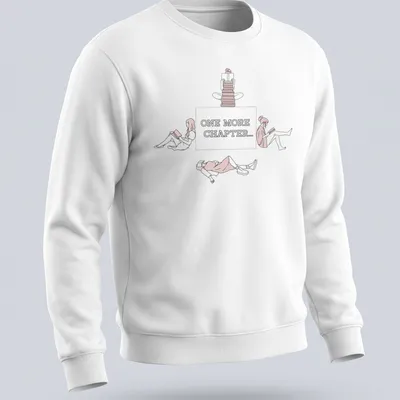 Line-art graphic tee showing the text 'One More Chapter...' with book-themed illustrations — printed on a unisex sweatshirt
