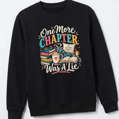 Whimsical design featuring books and coffee with the phrase 'One More Chapter Was A Lie' — printed on a unisex sweatshirt