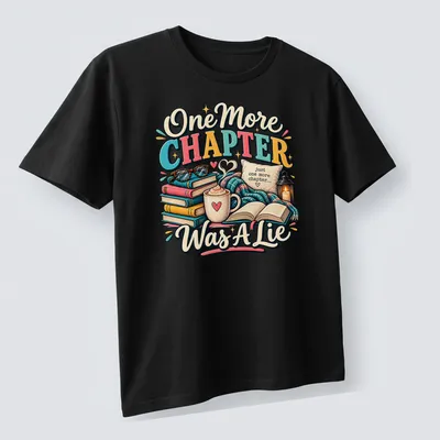 Whimsical design featuring books and coffee with the phrase 'One More Chapter Was A Lie' — printed on a unisex t-shirt (angled view)