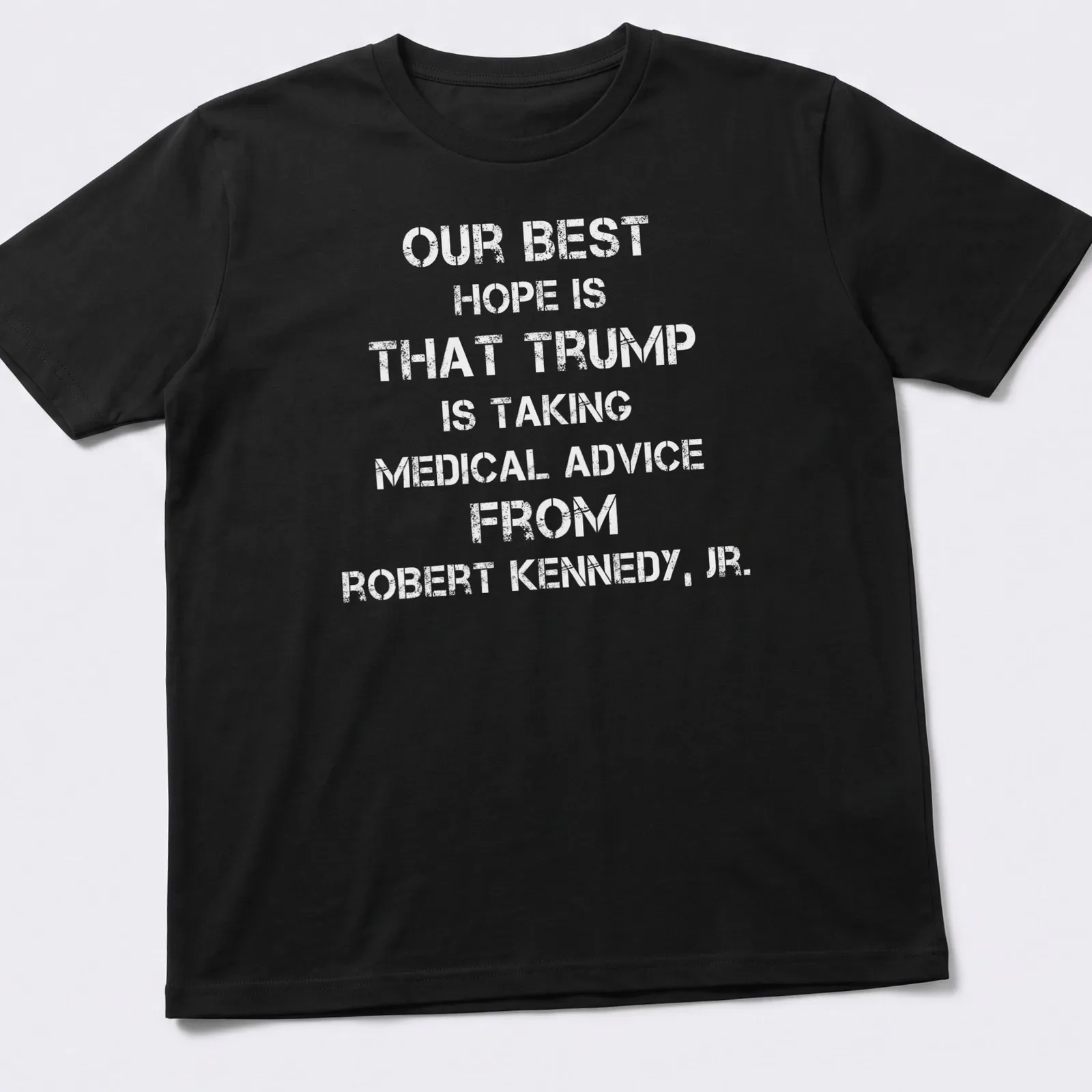 Bold text t-shirt stating a political message about Trump and Kennedy Jr. — printed on a unisex t-shirt