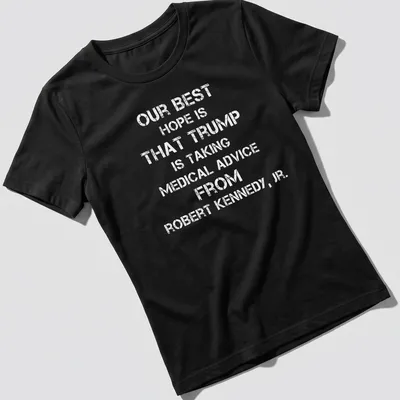 Bold text t-shirt stating a political message about Trump and Kennedy Jr. — printed on a women's shirt