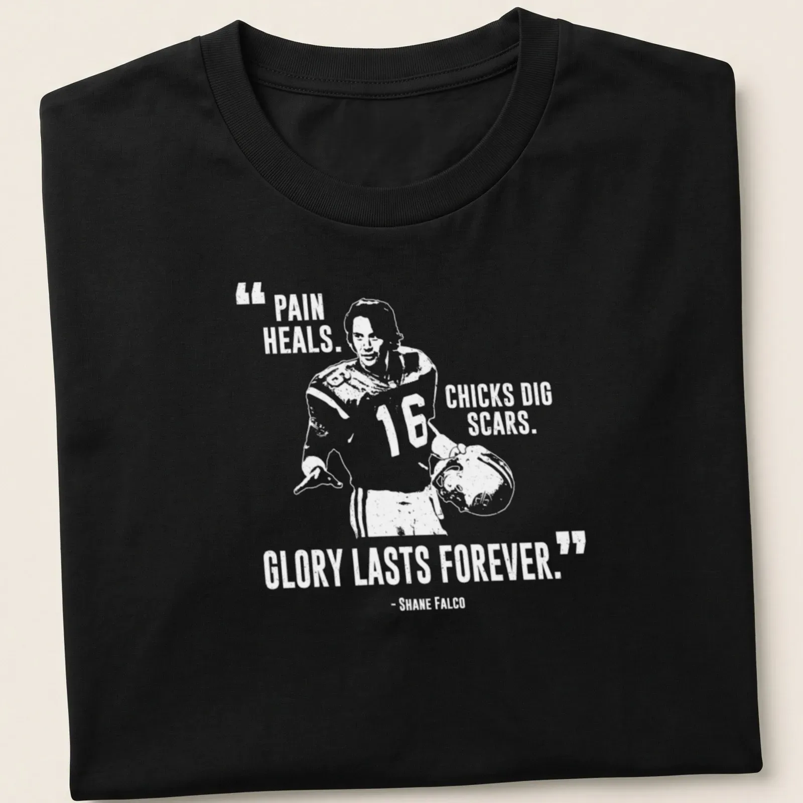 Bold typography t-shirt with the phrase Pain Heals, Chicks Dig Scars, Glory Lasts Forever over a football player graphic — printed on a unisex t-shirt