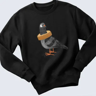 Cartoon illustration of a black pigeon stuck in a loaf of bread with humorous text — printed on a unisex sweatshirt