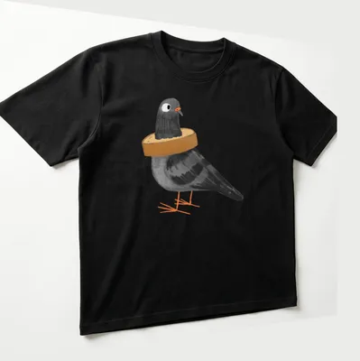Cartoon illustration of a black pigeon stuck in a loaf of bread with humorous text — printed on a unisex t-shirt (angled view)