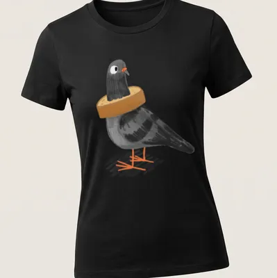 Cartoon illustration of a black pigeon stuck in a loaf of bread with humorous text — printed on a women's shirt