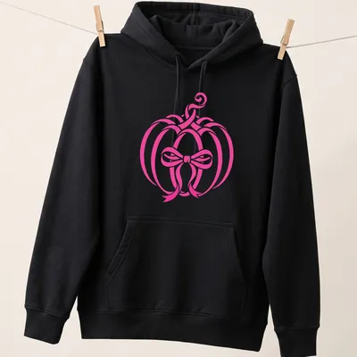 Modern minimalist pink pumpkin with a bow design for Halloween — printed on a unisex hoodie