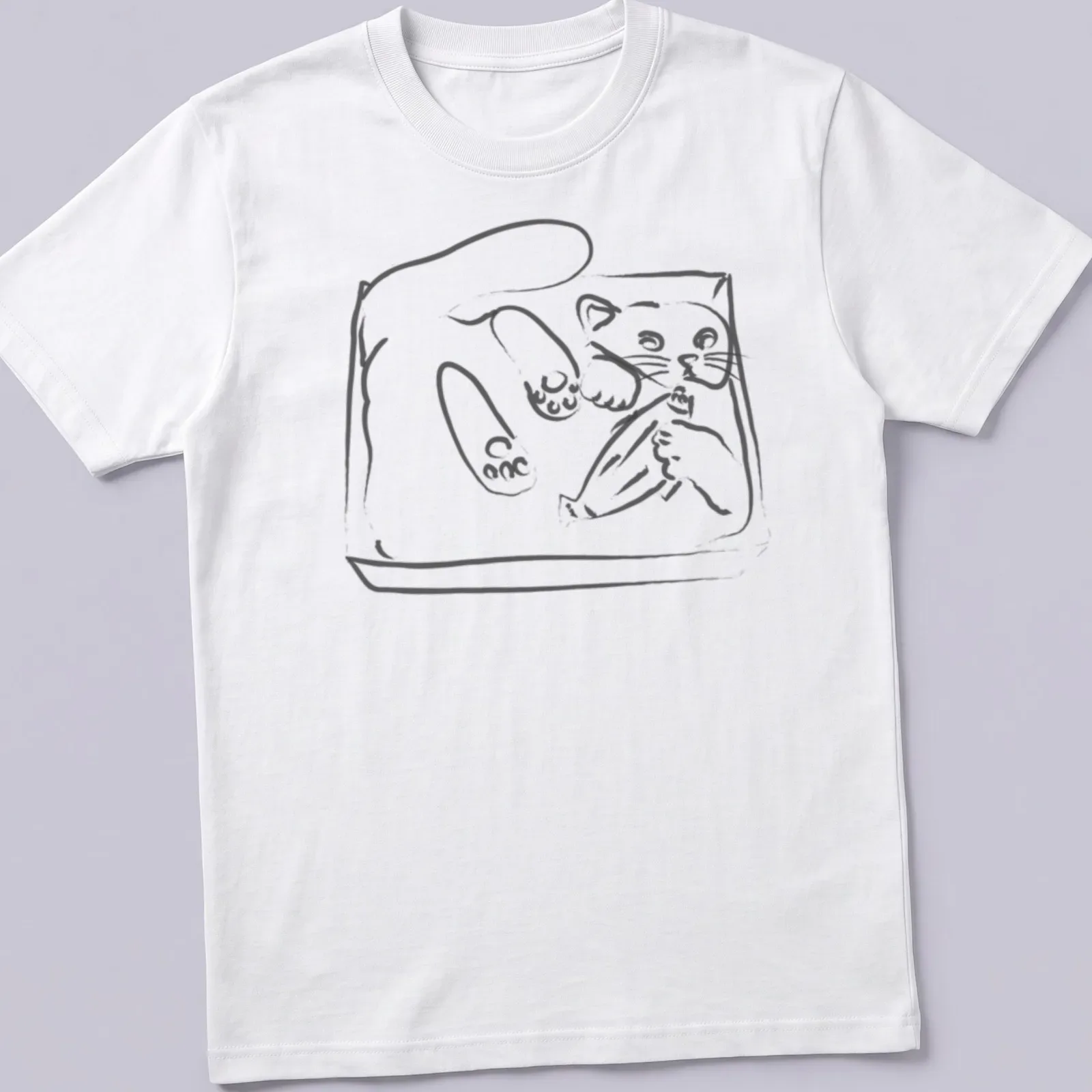 Simple line-art of a playful kitten wiggling in a tray in black and white — printed on a unisex t-shirt