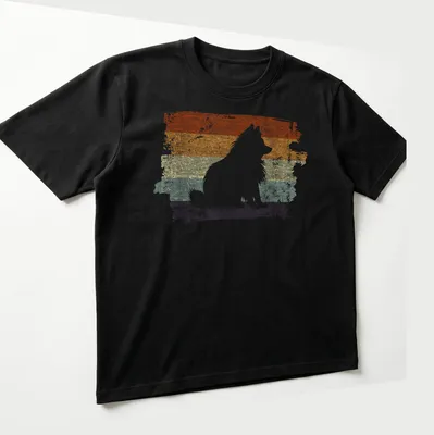 Distressed retro Pomeranian dog graphic in orange and cream tones — printed on a unisex t-shirt (angled view)
