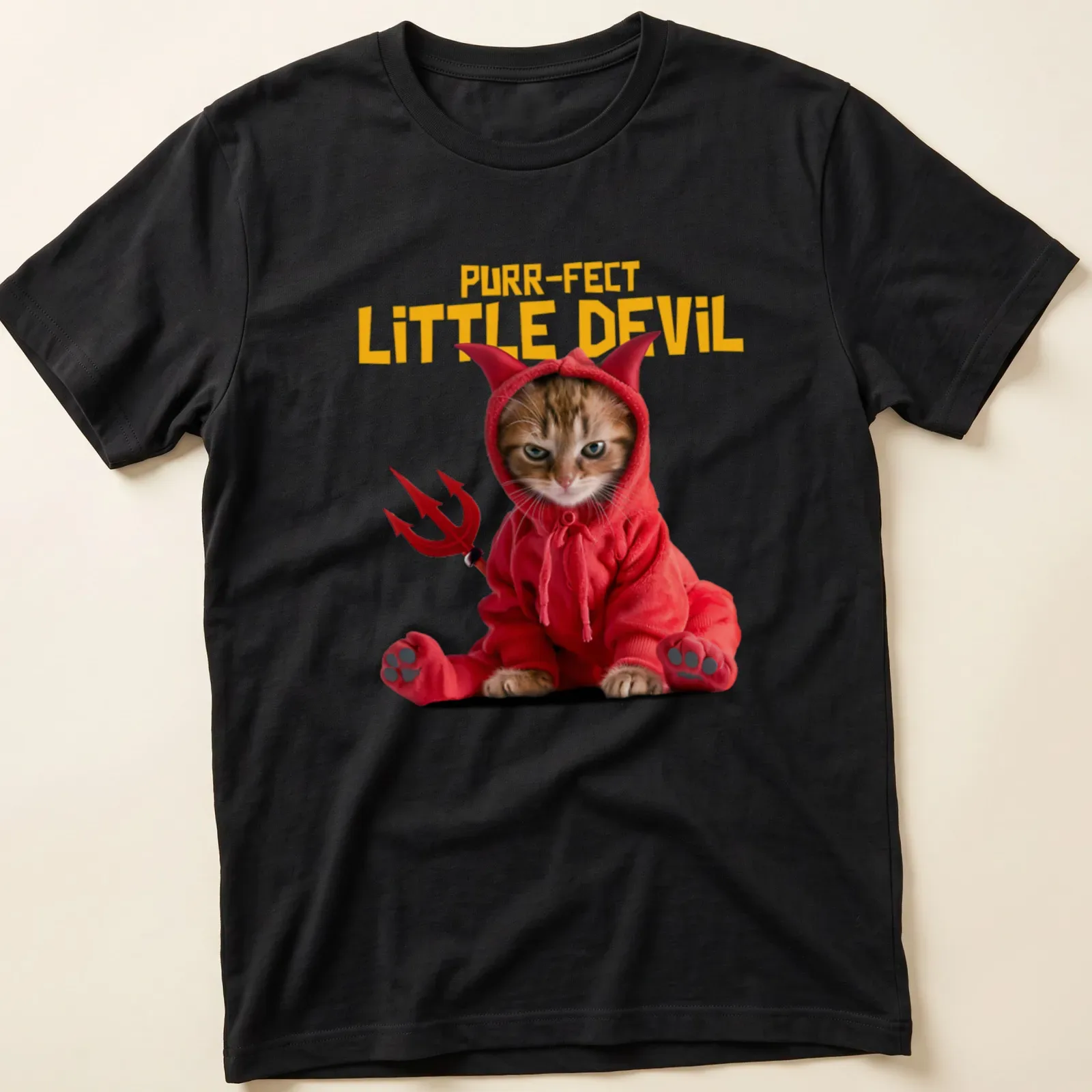 Playful illustration of a cat with the phrase 'Purr-fect Little Devil' in vibrant colors. — printed on a unisex t-shirt