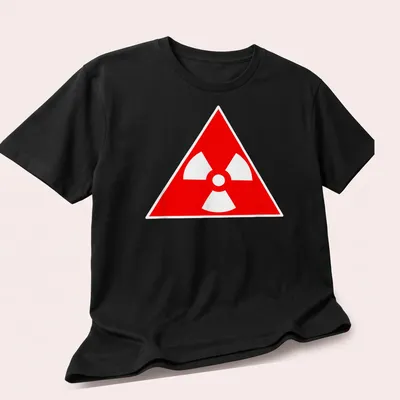 Vintage radioactive symbol graphic on a red — printed on a unisex t-shirt (angled view)