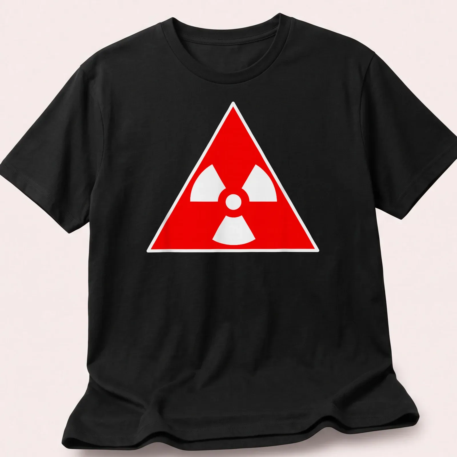 Vintage radioactive symbol graphic on a red — printed on a unisex t-shirt