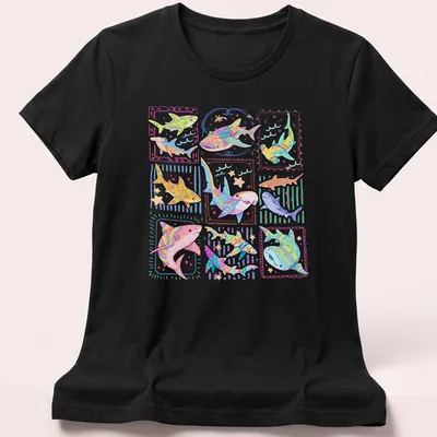 Colorful kawaii sharks illustration with playful text for kids' — printed on a women's shirt