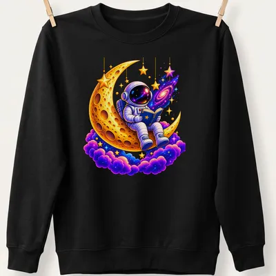 Cartoon astronaut reading on a colorful golden crescent moon — printed on a unisex sweatshirt
