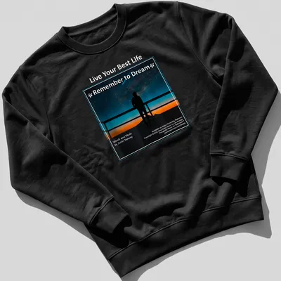 Silhouette gazing at stars with inspirational text in blue, black, orange, and white — printed on a unisex sweatshirt