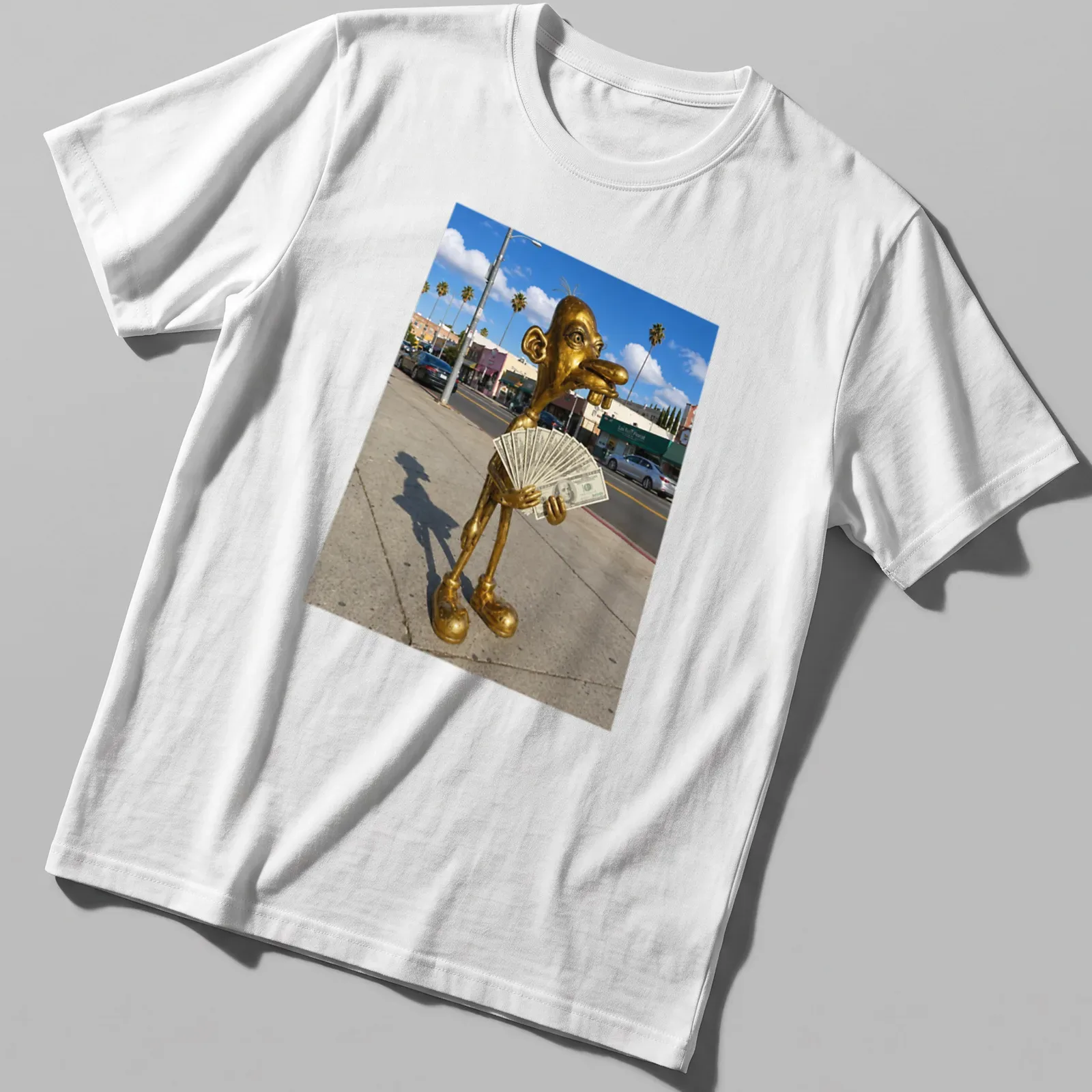 Realistic print of a golden statue holding cash, set against vibrant colors — printed on a unisex t-shirt