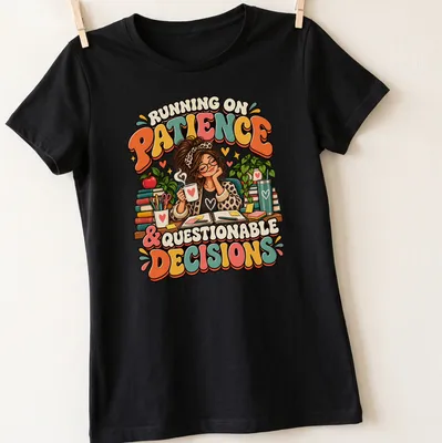 Colorful cartoon t-shirt featuring a female teacher with coffee and books alongside the quote about patience and decisions — printed on a women's shirt