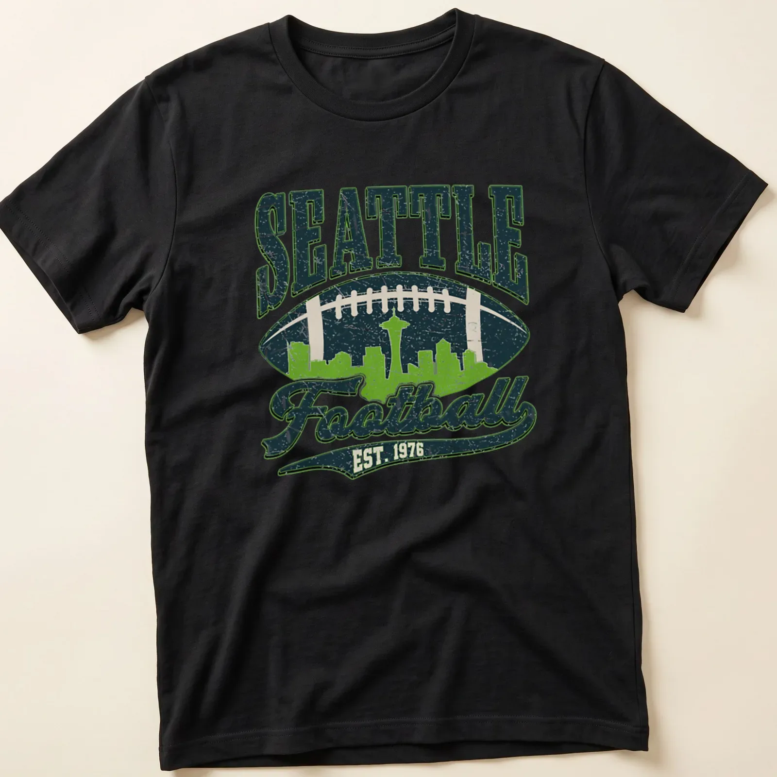 Retro skyline of Seattle with football and text in navy, green, and white — printed on a unisex t-shirt