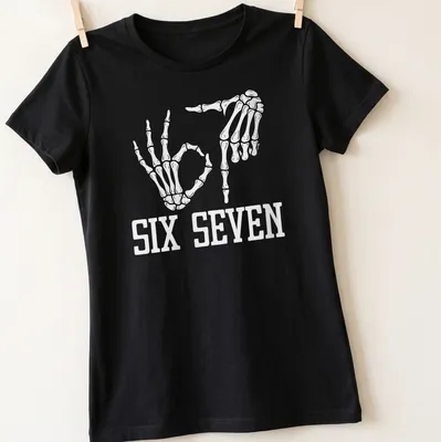 White t-shirt with skeleton hands and the text SIX SEVEN in a fun design. — printed on a women's shirt