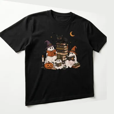 Whimsical illustration of ghosts reading in witch hats with text 'Spooky Bookworms.' — printed on a unisex t-shirt (angled view)