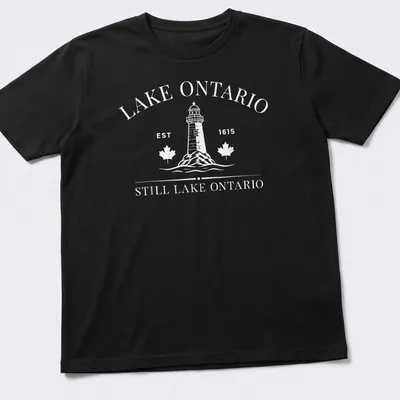 Vintage lighthouse graphic with Lake Ontario established date in black and white — printed on a unisex t-shirt