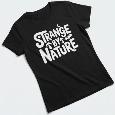 Colorful nature scene t-shirt featuring the text 'Strange By Nature' above an illustration. — printed on a women's shirt