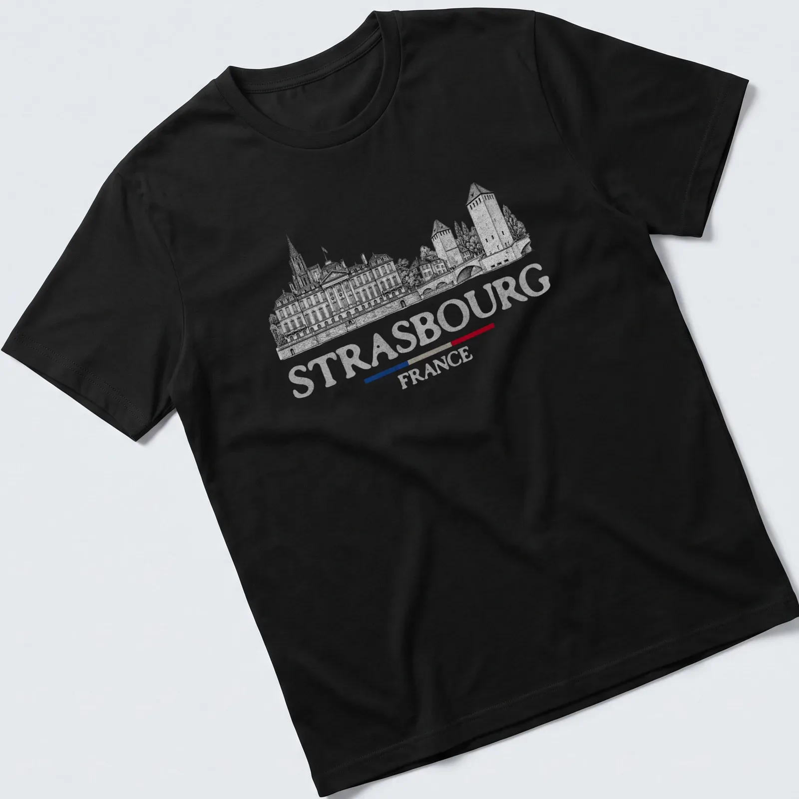 Vintage travel tee featuring Strasbourg architecture with black, white, red, and blue colors — printed on a unisex t-shirt