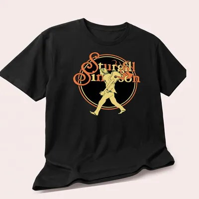 Vintage tee featuring a walking guitarist with text 'Sturgill Simpson' in yellow and black — printed on a unisex t-shirt (angled view)