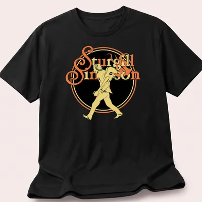 Vintage tee featuring a walking guitarist with text 'Sturgill Simpson' in yellow and black — printed on a unisex t-shirt