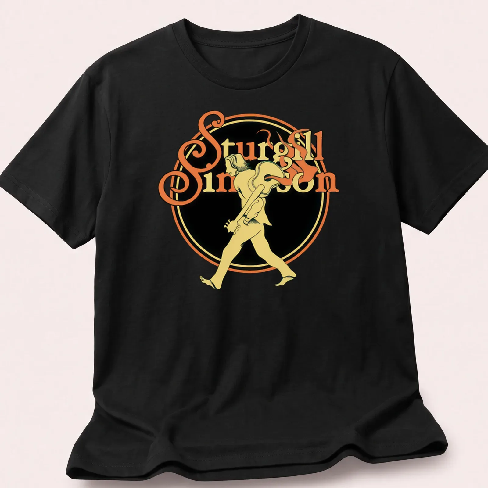 Vintage tee featuring a walking guitarist with text 'Sturgill Simpson' in yellow and black — printed on a unisex t-shirt