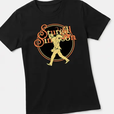 Vintage tee featuring a walking guitarist with text 'Sturgill Simpson' in yellow and black — printed on a women's shirt