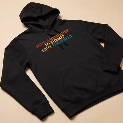 Bold colorful shirt featuring the text 'SUBTLE REMINDER TO SUBMIT YOUR TIMESHEET' — printed on a unisex hoodie