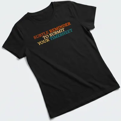 Bold colorful shirt featuring the text 'SUBTLE REMINDER TO SUBMIT YOUR TIMESHEET' — printed on a women's shirt