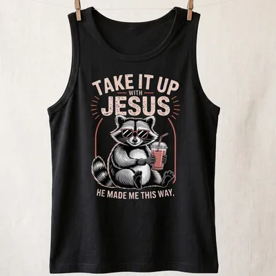 Cartoon raccoon holding a drink with humorous text about Jesus — printed on a tank top