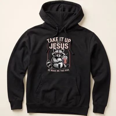 Cartoon raccoon holding a drink with humorous text about Jesus — printed on a unisex hoodie