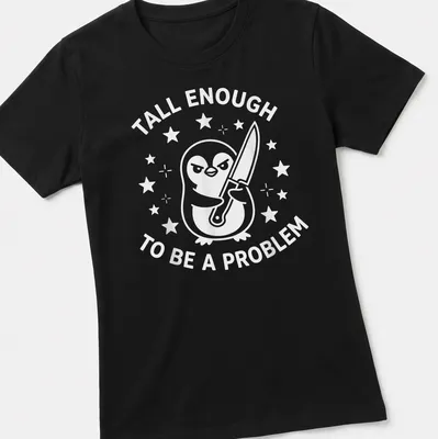 Funny cartoon penguin t-shirt with text about being tall enough to be a problem — printed on a women's shirt