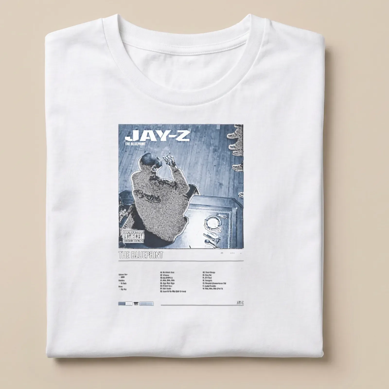 Jay-Z album cover graphic on a T-shirt featuring bold text and colors — printed on a unisex t-shirt