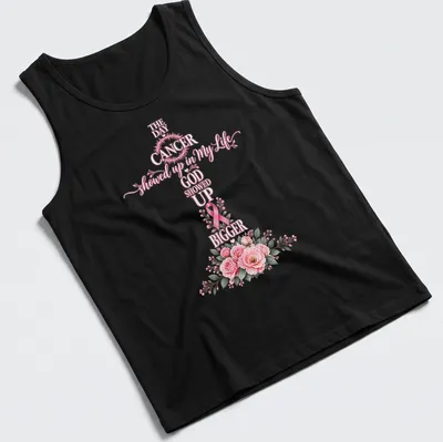 Floral shirt with a cross, pink ribbon, and script that reads about faith in the face of cancer — printed on a tank top