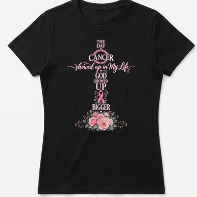 Floral shirt with a cross, pink ribbon, and script that reads about faith in the face of cancer — printed on a women's shirt