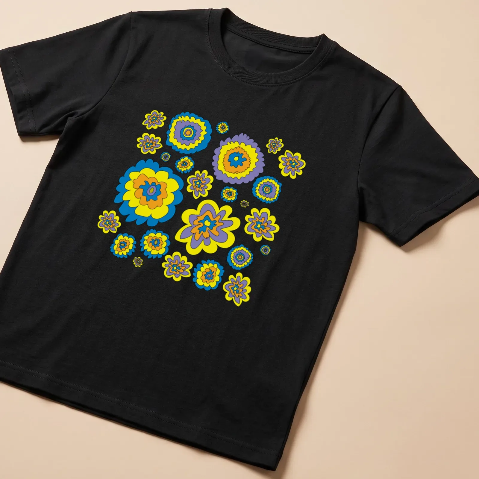 Graphic t-shirt featuring colorful flowers in blue, yellow, purple, and orange — printed on a unisex t-shirt