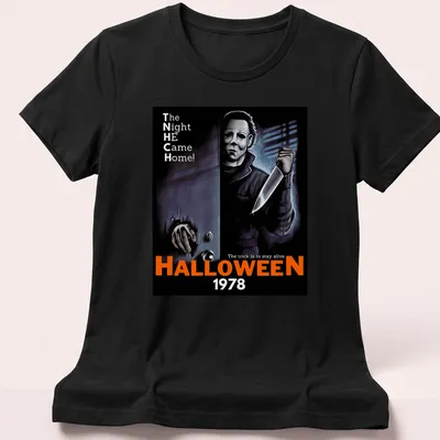 Retro horror t-shirt featuring Michael Myers and Halloween 1978 text in black, orange, white, and gray. — printed on a women's shirt