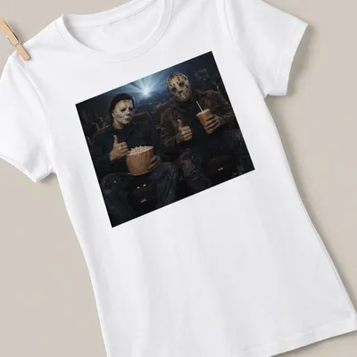 Cinematic print featuring Michael Myers and Jason Voorhees with a thumbs up — printed on a women's shirt
