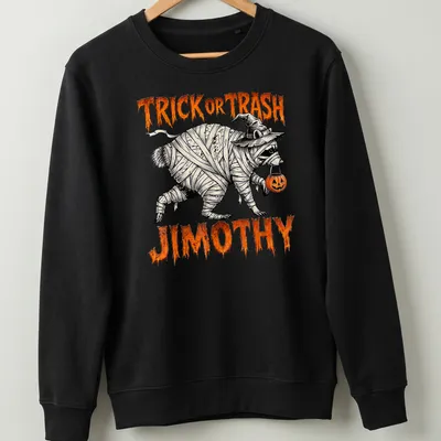 Halloween-themed shirt featuring a mummy raccoon with fun text — printed on a unisex sweatshirt